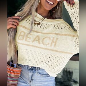 798. Knit “BEACH” sweater in cream